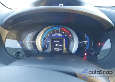 2011 Honda Insight from USA, damaged, VIN JHMZE2H31BS010819